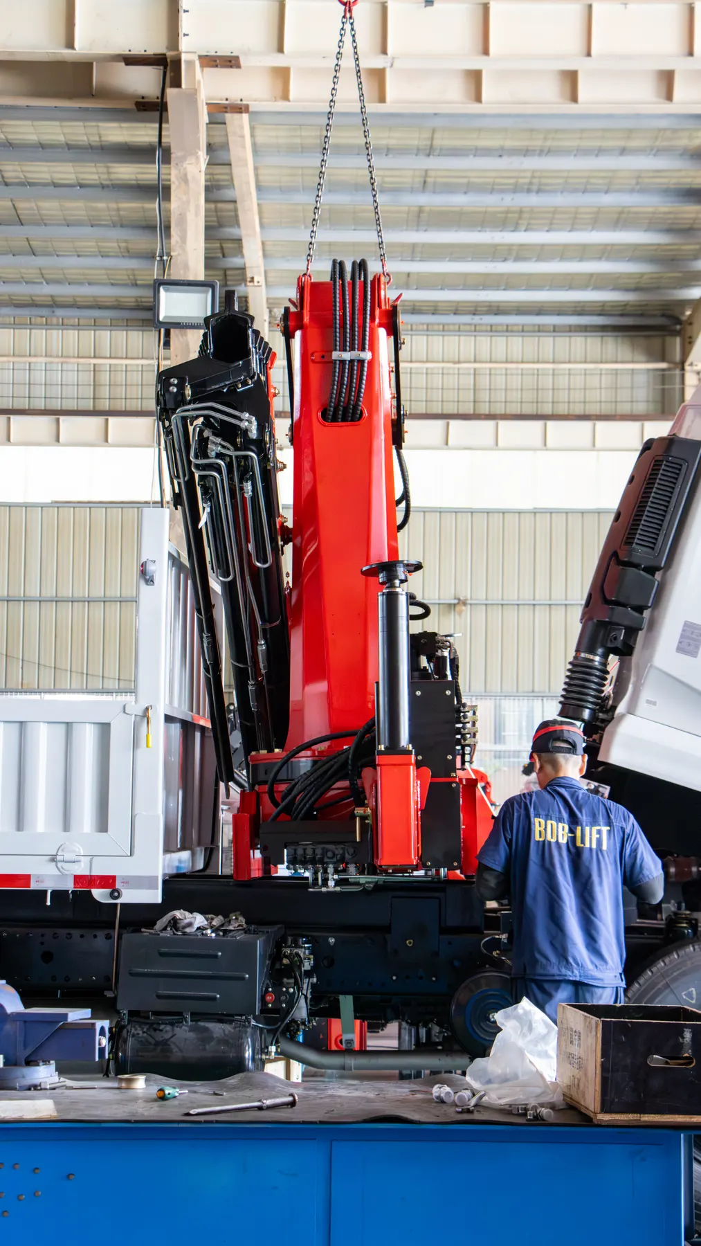 Lift the crane onto the chassis