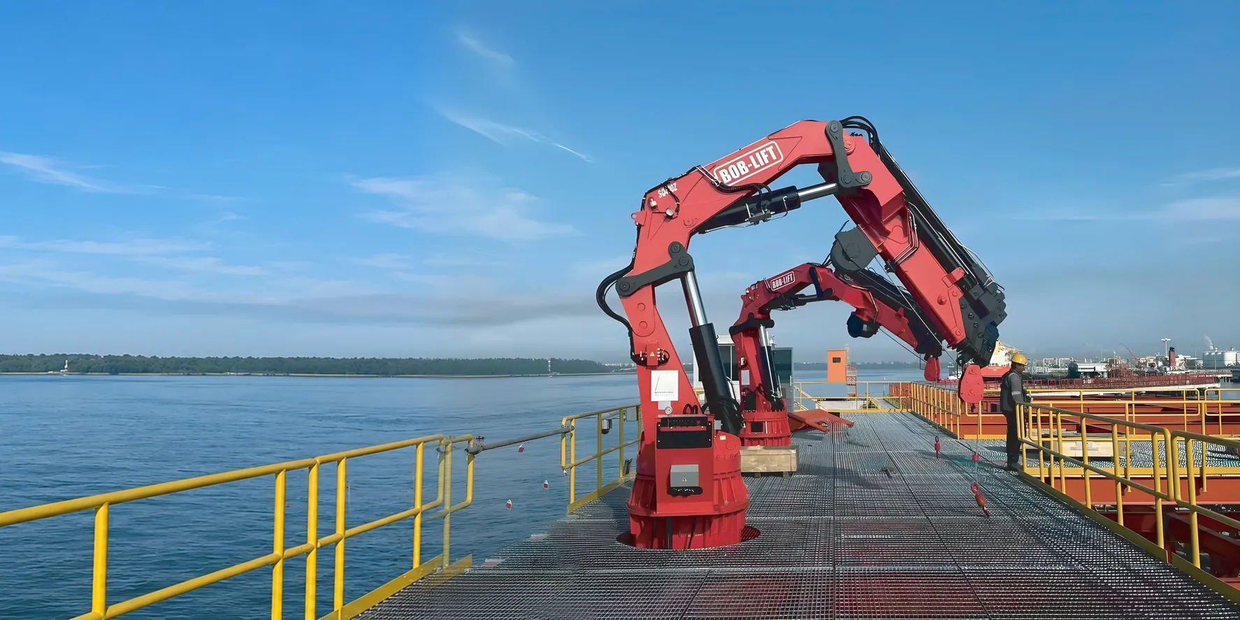 BOB-LIFT knuckle boom marine crane lifting a cargo container on a supply vessel